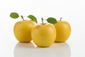 3 golden delicious apples on white background