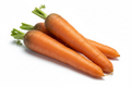 3 jumbo grocery store carrots on white background